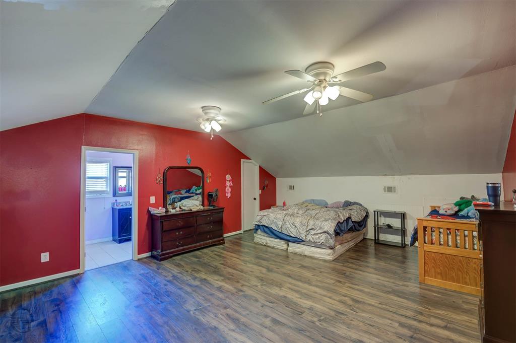 120 Bella Vista Loop Homer, LA 71040 - Photo 14 of 27 Bedroom featuring dark wood-style flooring, lofted ceiling, a ceiling fan, and ensuite bathroom