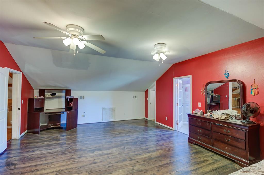 120 Bella Vista Loop Homer, LA 71040 - Photo 16 of 27 Additional living space with vaulted ceiling, dark wood finished floors, and ceiling fan
