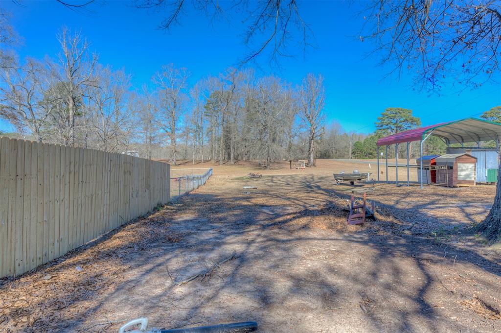 120 Bella Vista Loop Homer, LA 71040 - Photo 23 of 27 View of yard with a detached carport