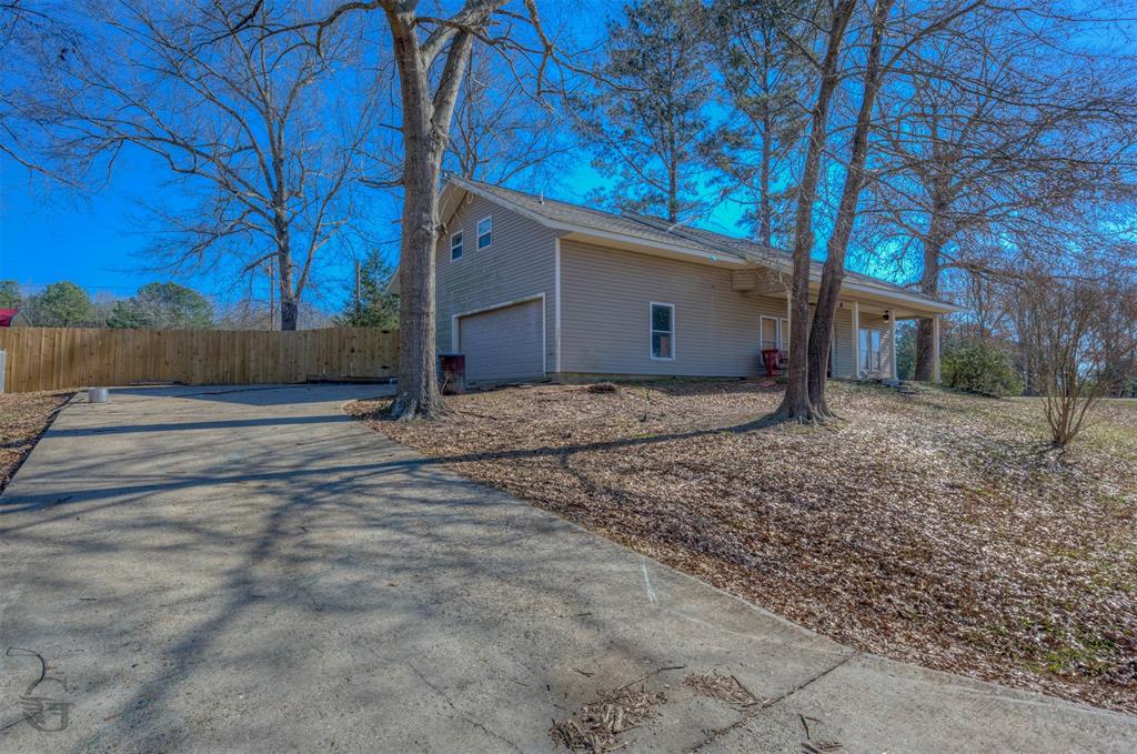 120 Bella Vista Loop Homer, LA 71040 - Photo 3 of 27 View of home's exterior featuring driveway and a garage