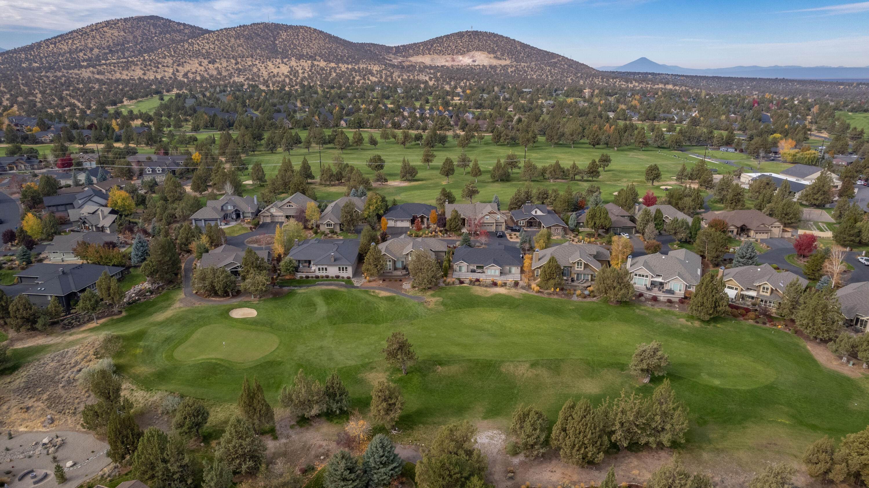 9009 Merlin Drive Redmond, OR 97756 - Photo 95 of 98 a view of a lush green hillside and houses