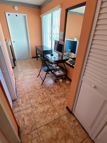 a bed room with a bed and a chandelier