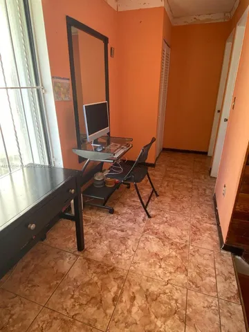 a room with gym equipment and equipment