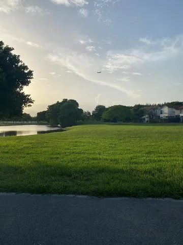 a view of an ocean and a yard