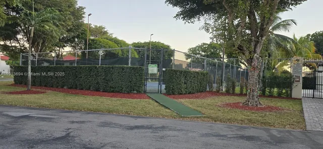 a view of a park with swings and slides