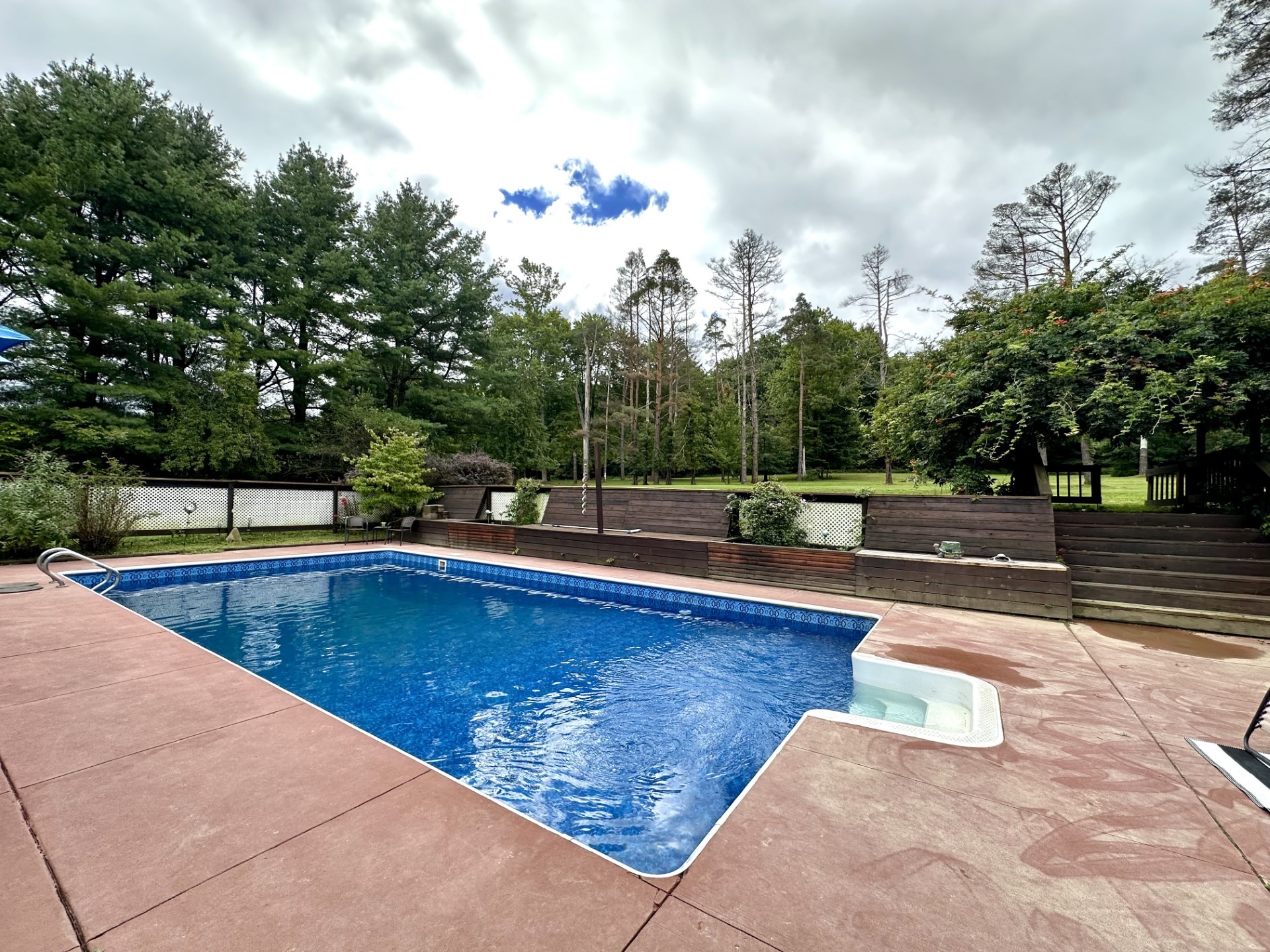 24155 State Rte 27 Meadville, PA 16335 - Photo 23 of 38 Pool area with privacy fence, built-in seating and planting areas