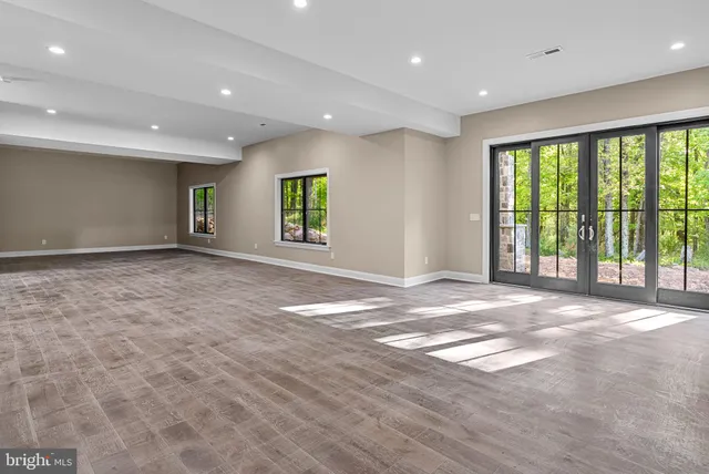 a front view of a house with a yard and fountain in middle