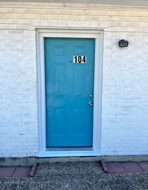 4906 West Gate Boulevard, Unit 104 Austin, TX 78745 - Photo 22 of 22 View of exterior entry featuring brick siding