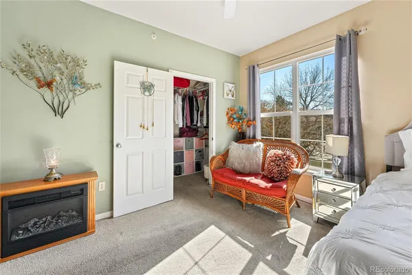 a bedroom with furniture and a window