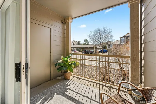 a view of a balcony with wooden floor