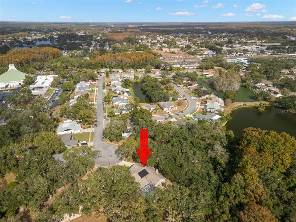 3734 Thornbush Lane New Port Richey, FL 34655 - Photo 1 of 47 an aerial view of residential building and lake