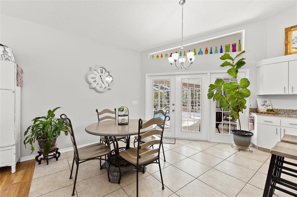 3734 Thornbush Lane New Port Richey, FL 34655 - Photo 17 of 47 a dining room with furniture and a potted plant