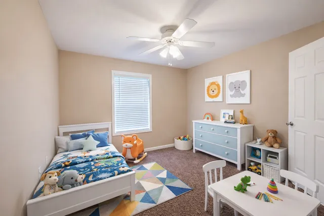 a bedroom with furniture and a window