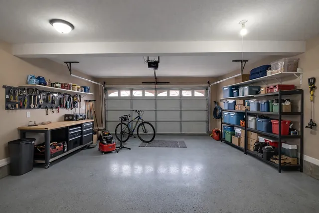 an empty room with a ceiling fan and window
