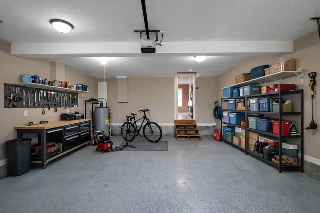 a view of a house with wooden deck and a yard
