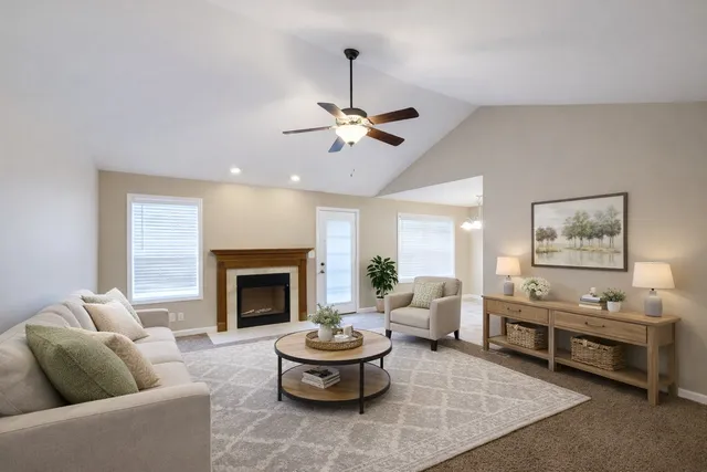 a living room with furniture and a fireplace