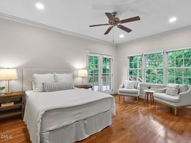 a bedroom with a large bed and a large window