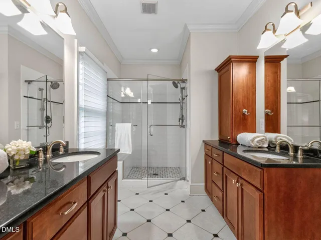 a bathroom with a sink a double vanity and a mirror