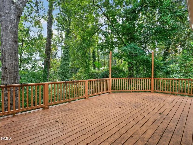 a view of deck with wooden floor and fence