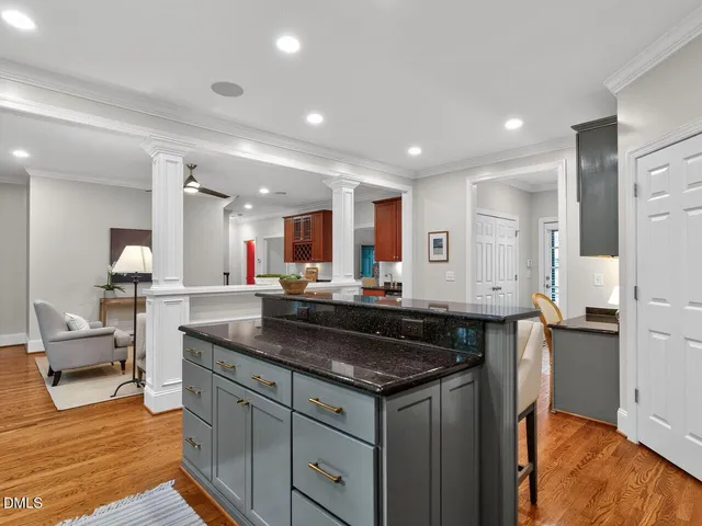 a kitchen with granite countertop a stove and a sink