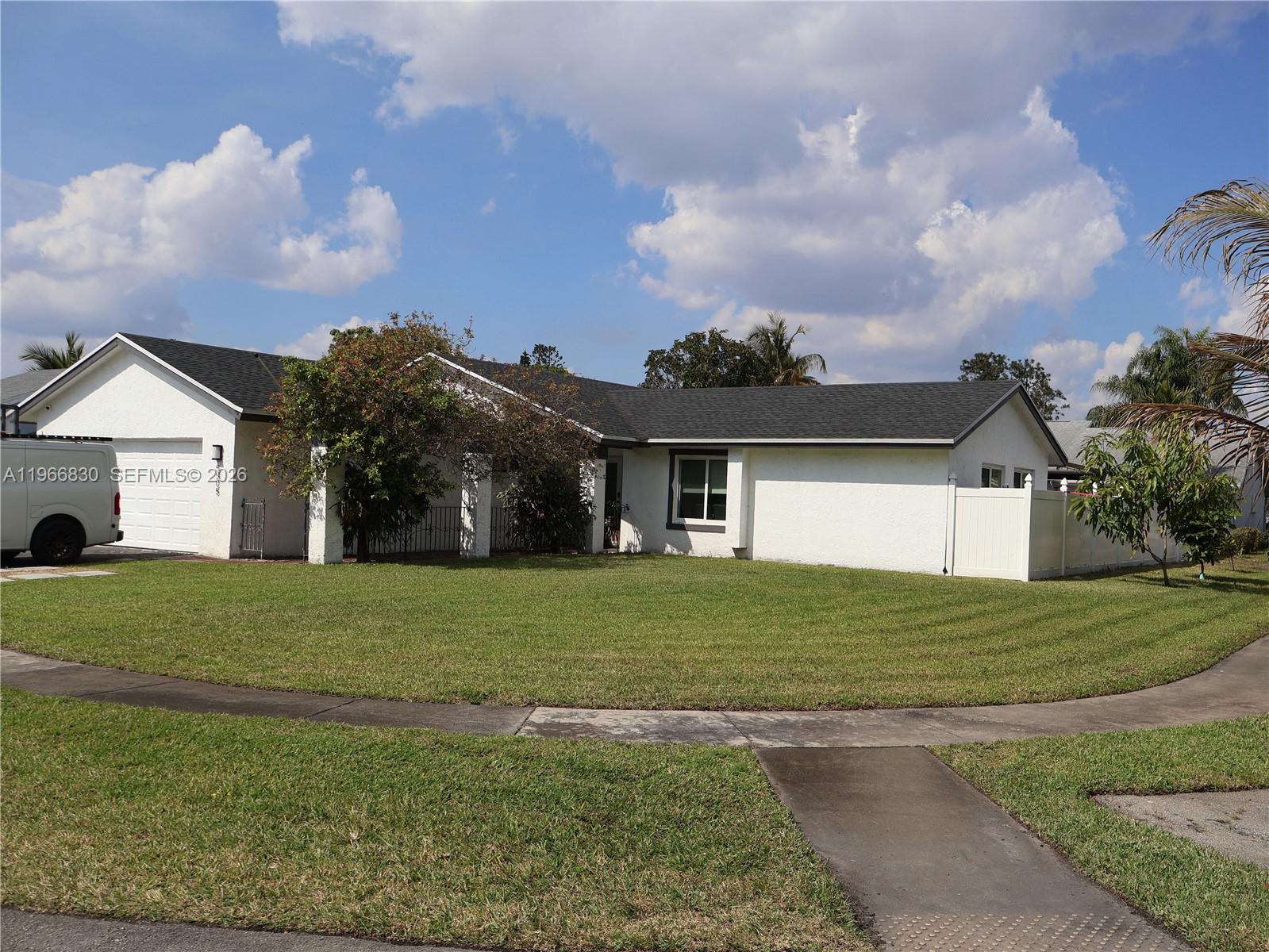 5505 Southwest 9th Street Margate, FL 33068 - Photo 11 of 53 a front view of a house with a yard