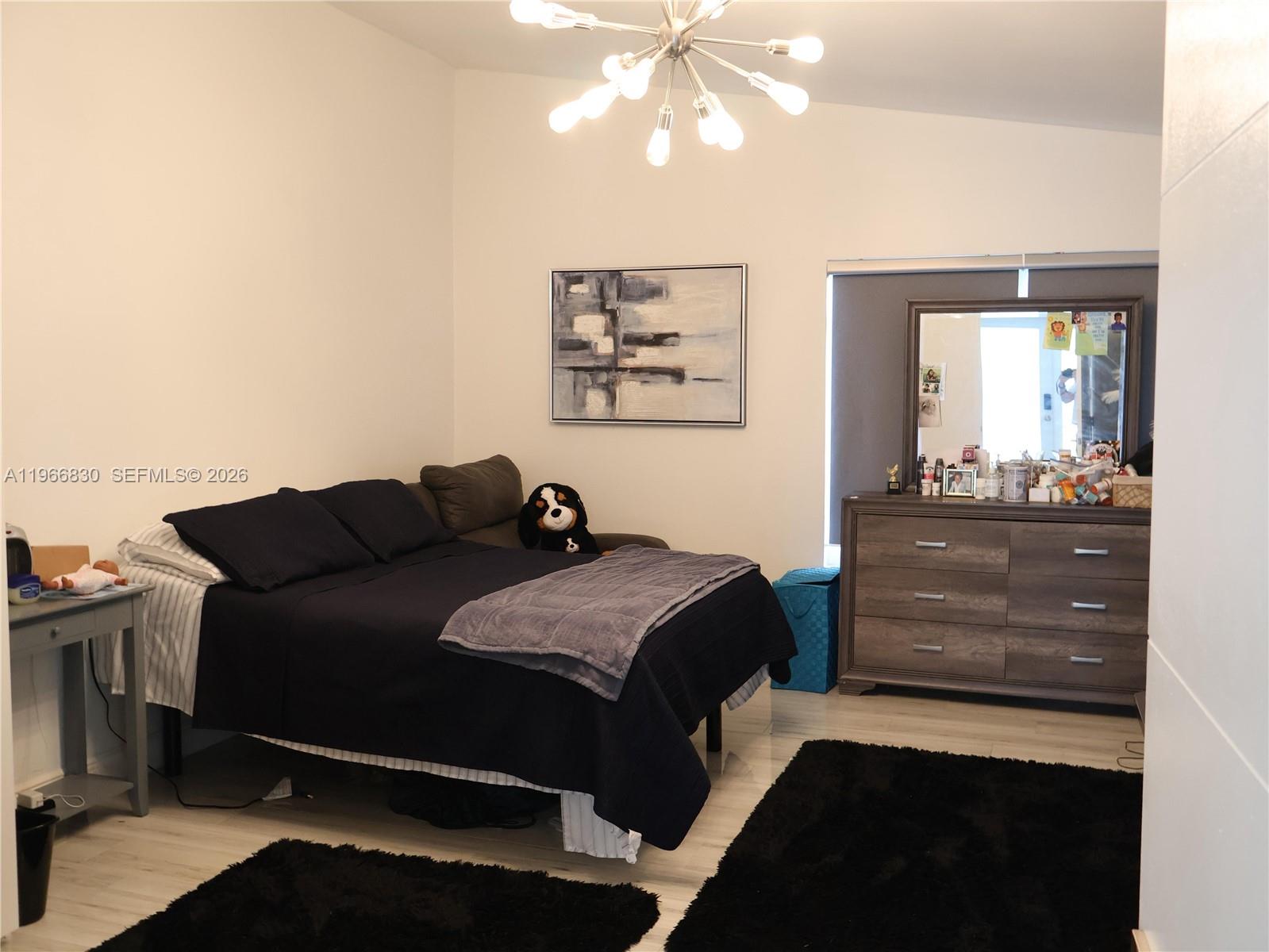 5505 Southwest 9th Street Margate, FL 33068 - Photo 16 of 53 a living room with a bed and furniture