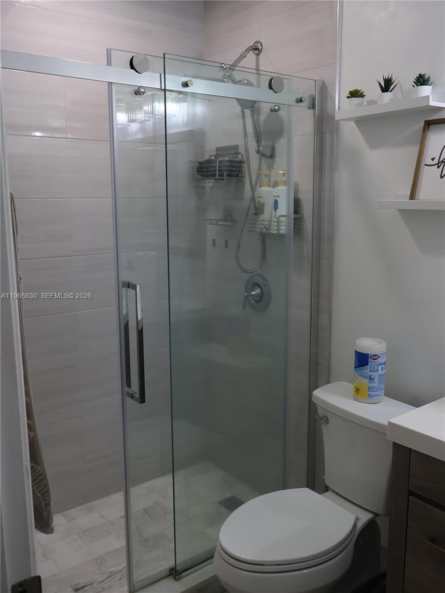 5505 Southwest 9th Street Margate, FL 33068 - Photo 20 of 53 a bathroom with a toilet and a shower