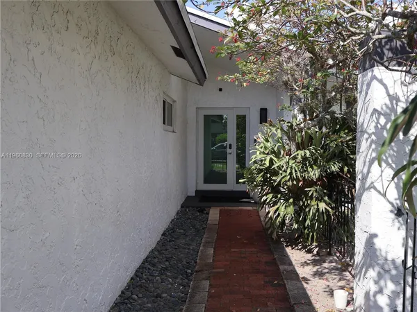 a view of a pathway with a house