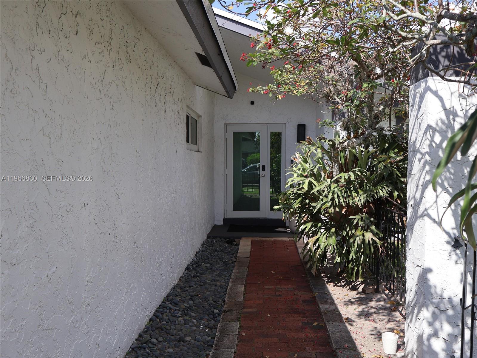 5505 Southwest 9th Street Margate, FL 33068 - Photo 2 of 53 a view of a pathway with a house