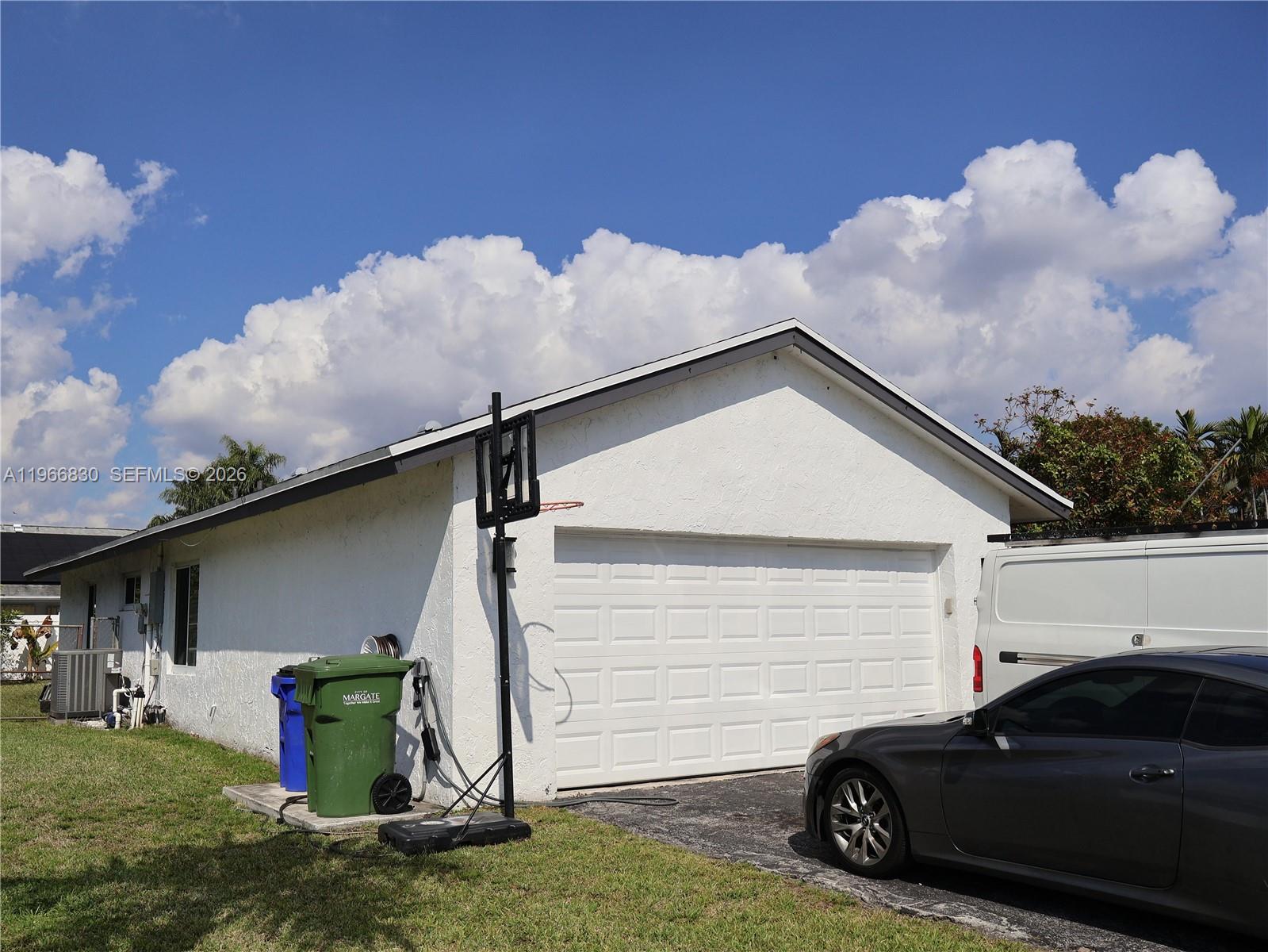 5505 Southwest 9th Street Margate, FL 33068 - Photo 21 of 53 a view of a car park in front of house