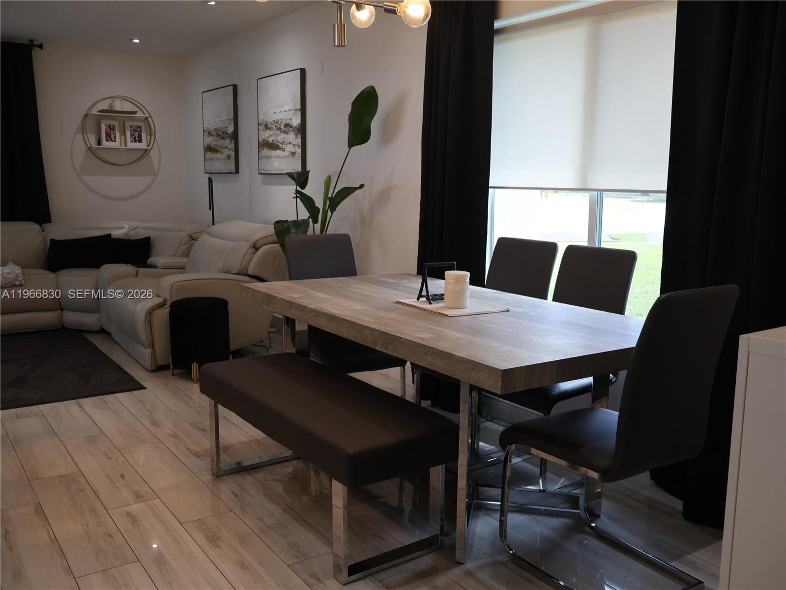 5505 Southwest 9th Street Margate, FL 33068 - Photo 24 of 53 a view of a dining room with furniture and wooden floor