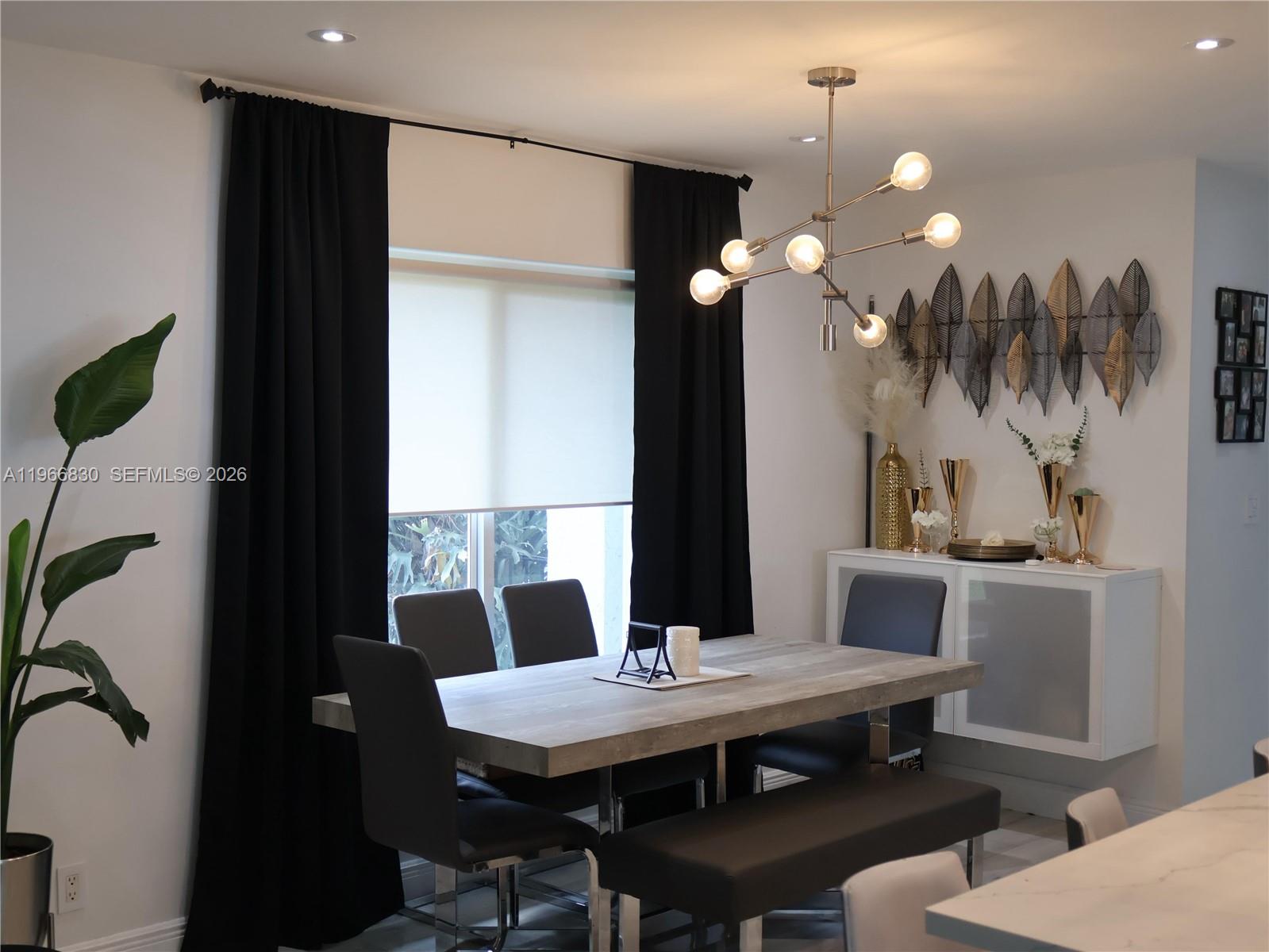 5505 Southwest 9th Street Margate, FL 33068 - Photo 30 of 53 a view of a dining room with furniture and chandelier