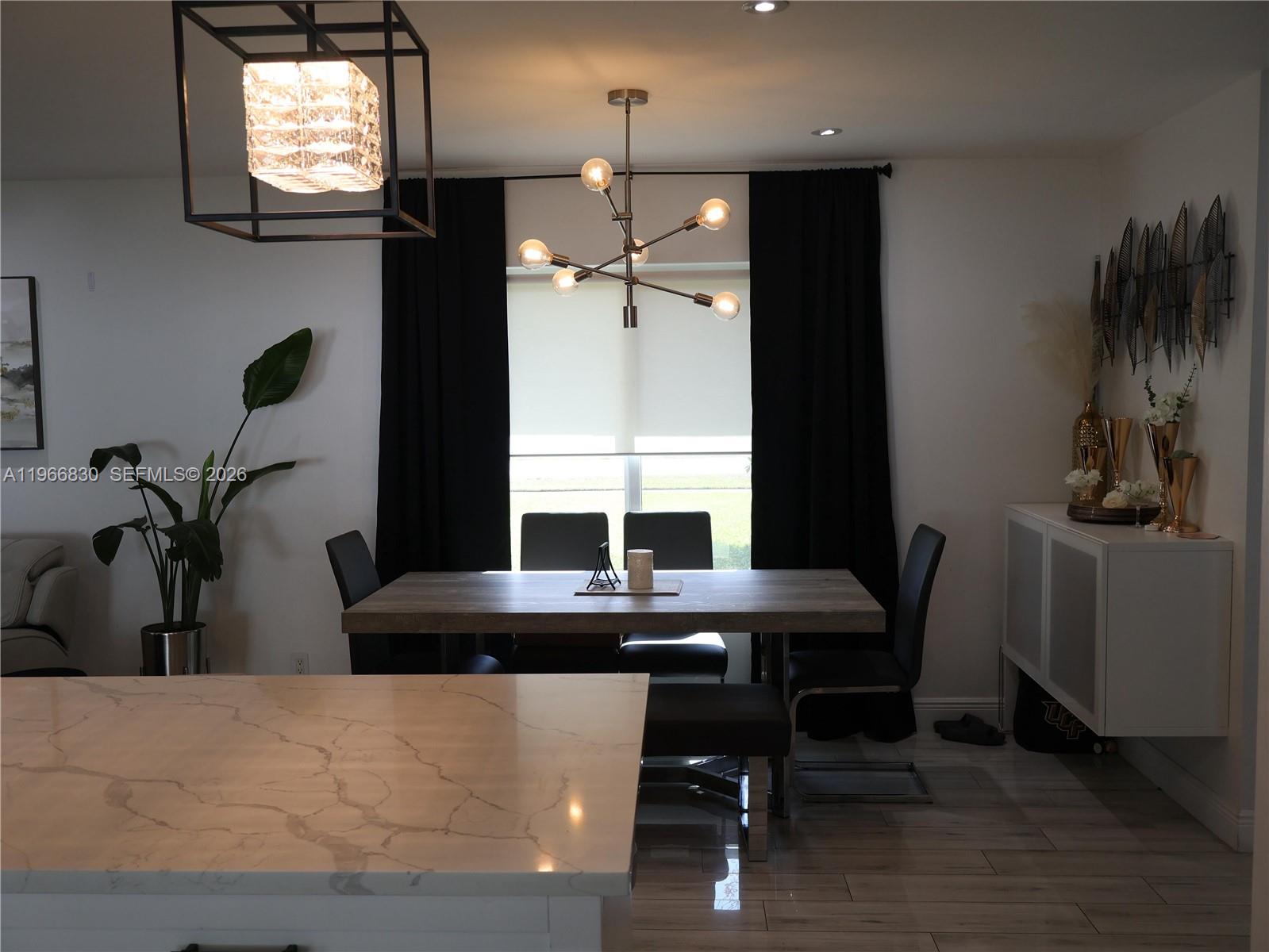 5505 Southwest 9th Street Margate, FL 33068 - Photo 32 of 53 a view of a dining room with furniture and window