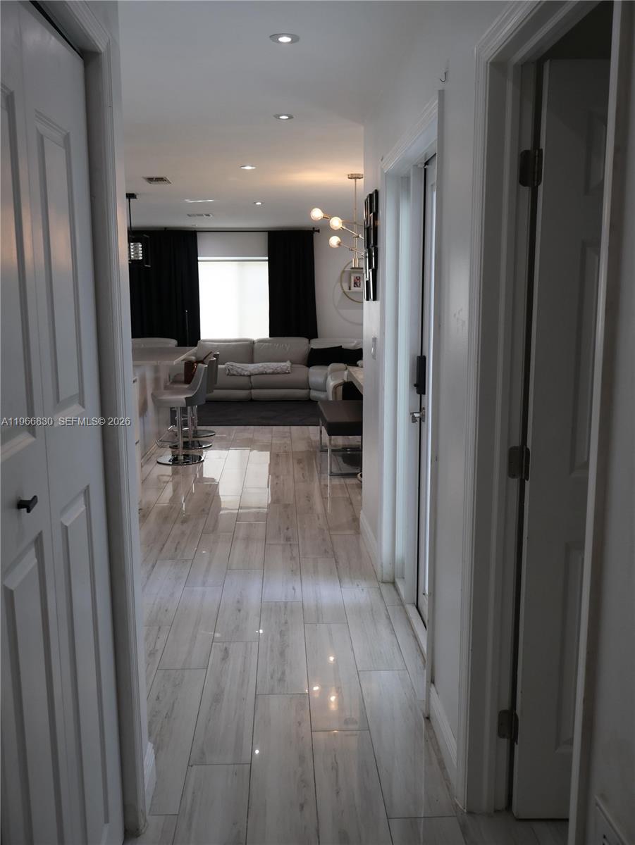 5505 Southwest 9th Street Margate, FL 33068 - Photo 34 of 53 a view of a living room and a wooden floor