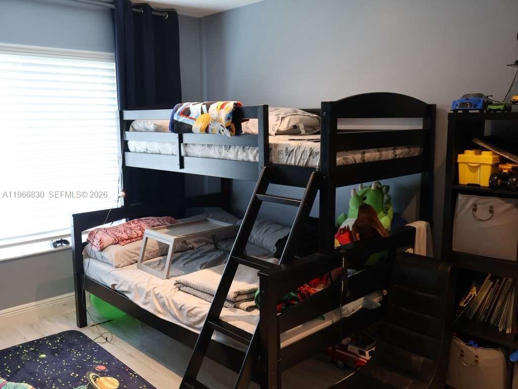 5505 Southwest 9th Street Margate, FL 33068 - Photo 39 of 53 a living room with furniture and a flat screen tv