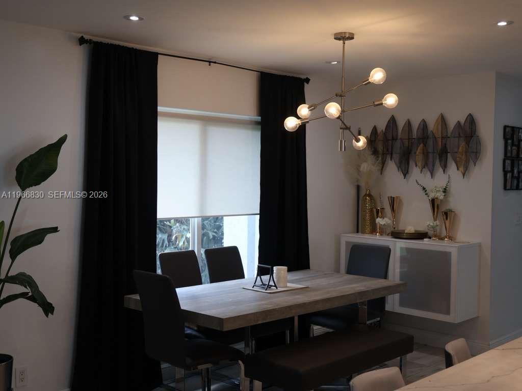 5505 Southwest 9th Street Margate, FL 33068 - Photo 40 of 53 a view of a dining room with furniture and wooden floor