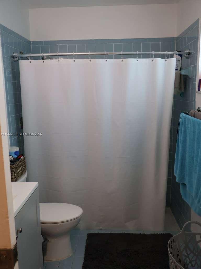 5505 Southwest 9th Street Margate, FL 33068 - Photo 41 of 53 a bathroom with a shower and a toilet