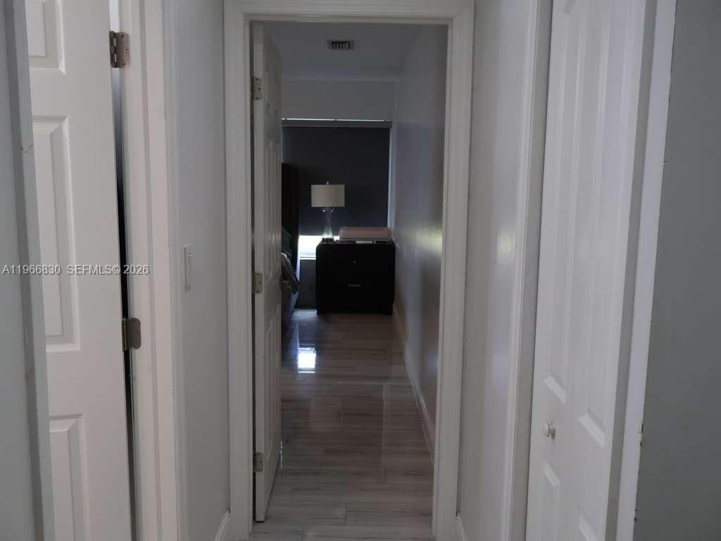 5505 Southwest 9th Street Margate, FL 33068 - Photo 42 of 53 a view of a bathroom from a hallway