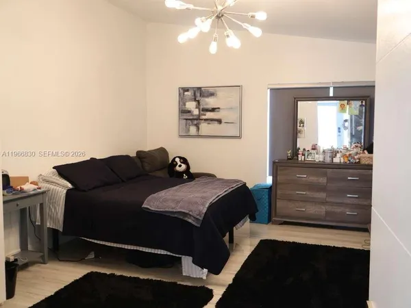 a desktop computer sitting on top of a desk next to a window