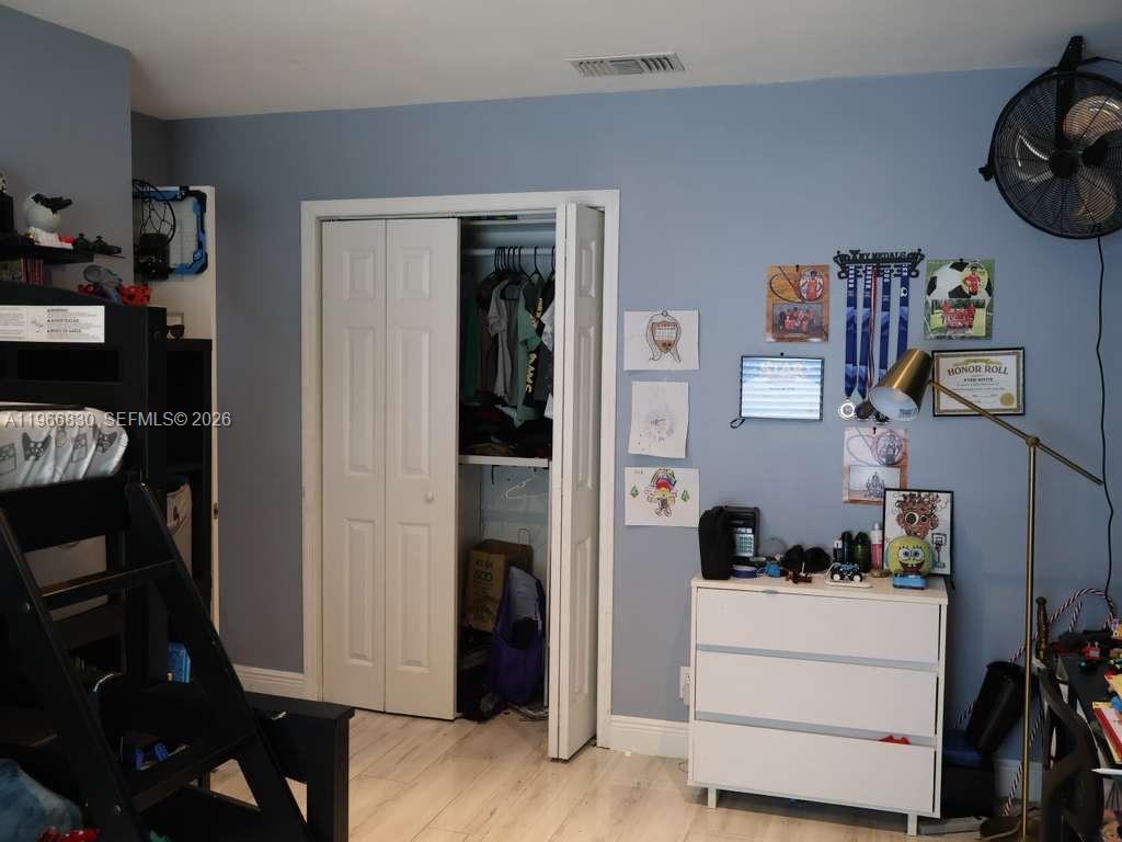 5505 Southwest 9th Street Margate, FL 33068 - Photo 48 of 53 a room with a refrigerator and cabinets