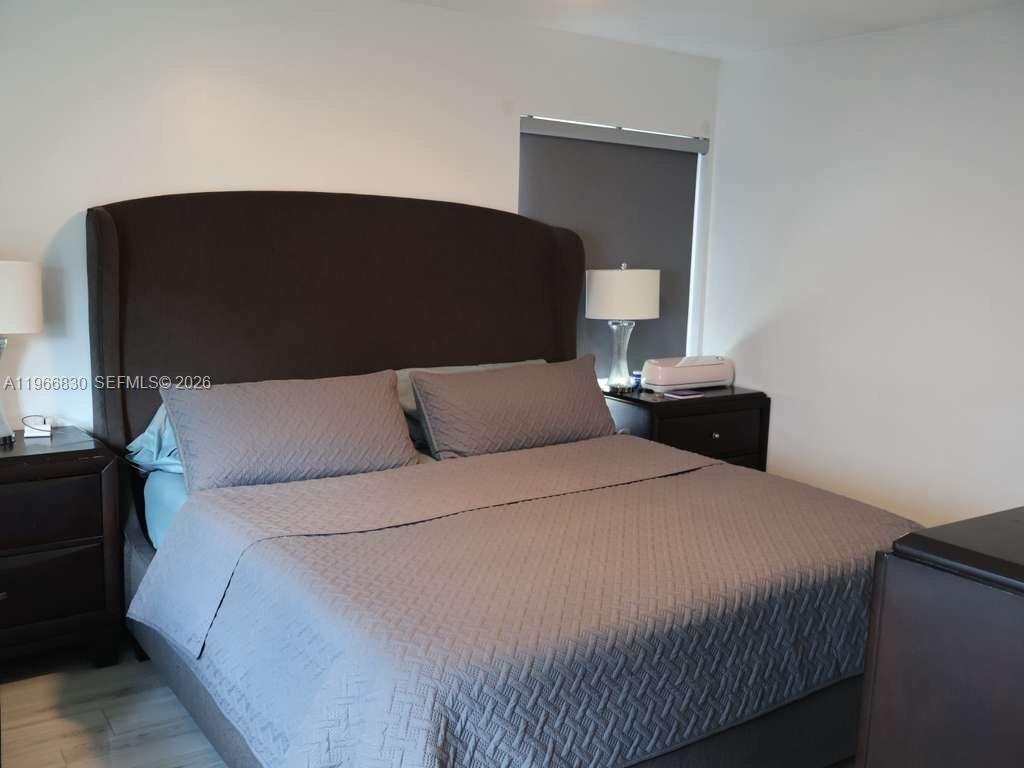 5505 Southwest 9th Street Margate, FL 33068 - Photo 50 of 53 a bedroom with a bed and window