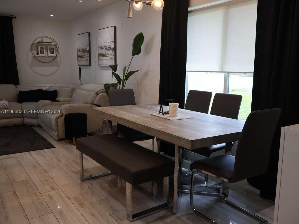 5505 Southwest 9th Street Margate, FL 33068 - Photo 51 of 53 a view of a dining room with furniture and wooden floor