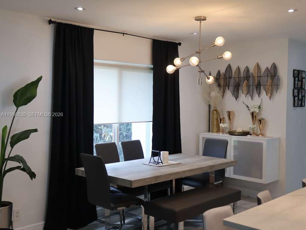 5505 Southwest 9th Street Margate, FL 33068 - Photo 52 of 53 a dining room with a table and chairs