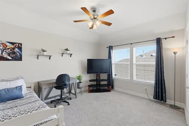 a bathroom with a sink toilet vanity and shower