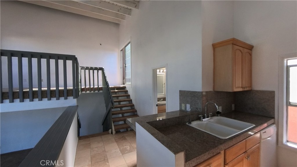 124 Buccaneer Street, Unit 1 Marina del Rey, CA 90292 - Photo 12 of 41 a kitchen with sink and a window