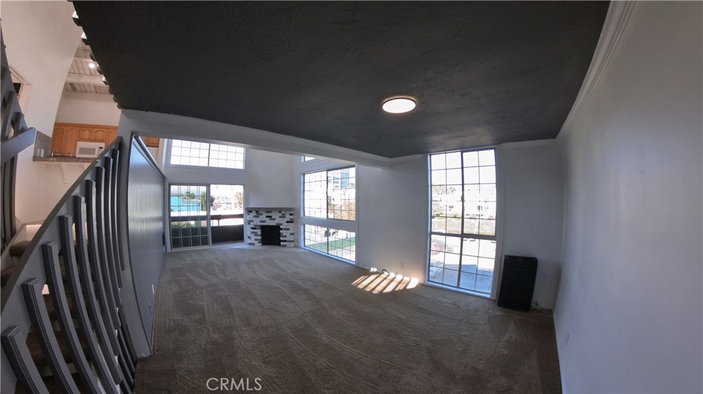 124 Buccaneer Street, Unit 1 Marina del Rey, CA 90292 - Photo 17 of 41 a view of a livingroom with a fireplace