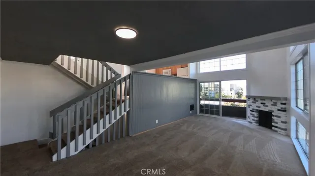a view of livingroom with furniture and windows