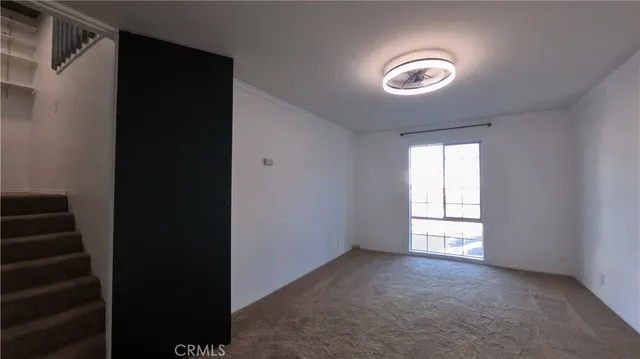 a view of empty room with a window