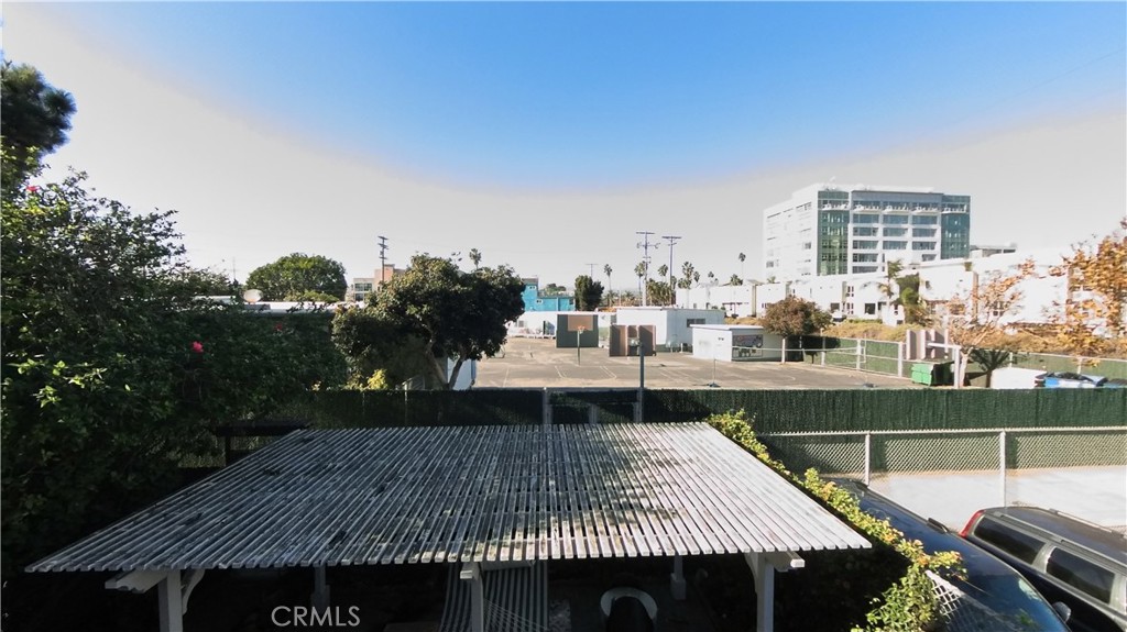 124 Buccaneer Street, Unit 1 Marina del Rey, CA 90292 - Photo 27 of 41 a view of a roof deck with couches and wooden floor