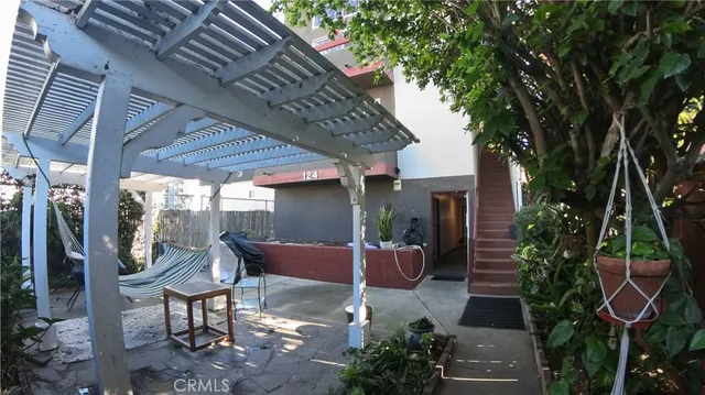 a backyard of a house with outdoor seating
